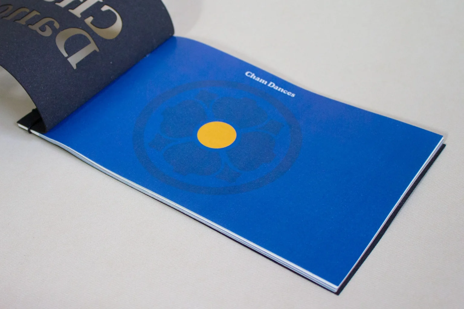 Front page of the book Cham masks featuring the title on a lotus flower